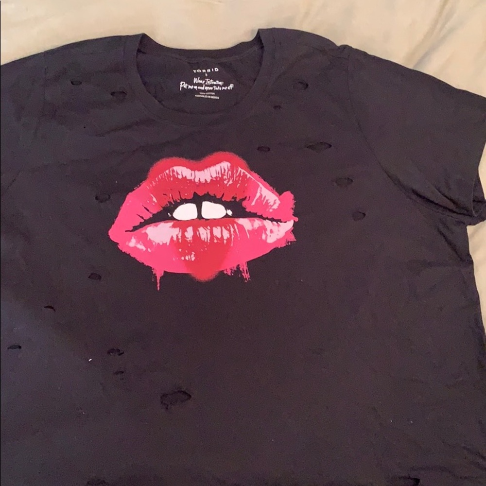 Purposefully distressed “band” tee.